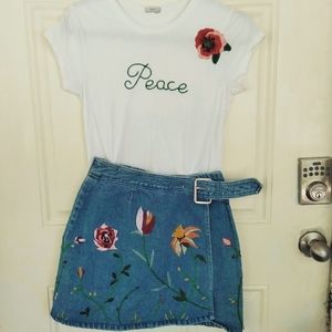 Embroidered tee and denim wrap mini skirt.
